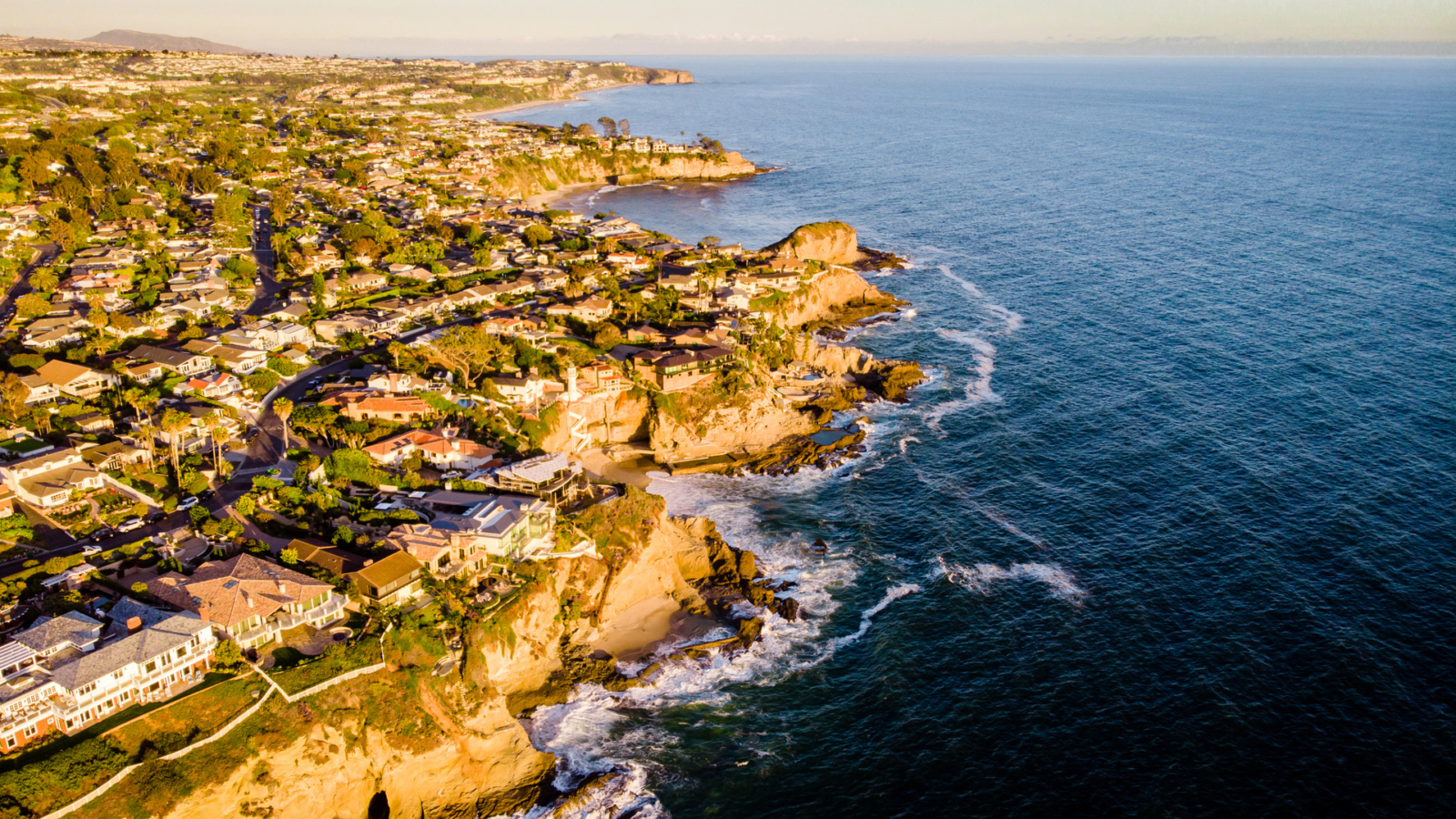 Drone view of luxury real estate buildings at the coast of Laguna Beach, California, USA